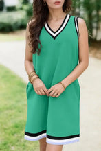 Green sleeveless dress with black and white trim, machine wash cold