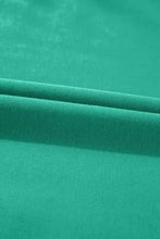 Teal velvet cushion with smooth texture, machine wash cold