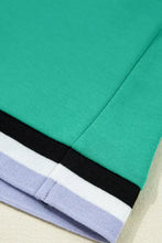 Teal and purple striped jersey shirt with black trim, machine wash cold