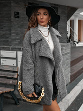 Grey teddy bear coat with fur texture and chain shoulder detail