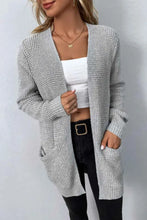 Grey textured knit cardigan with long sleeve length, pockets, and v-neck