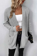 Grey textured knit cardigan with long sleeve length and pockets