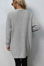 Gray oversized textured knit cardigan with long sleeve length and pockets