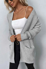 Light gray textured knit cardigan with long sleeve length and pockets