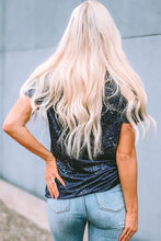 Woman in guitar graphic round neck T-shirt with blonde wavy hair