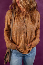 Women’s dropped shoulder long sleeve henley top in marled brown with jeans