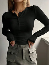 Woman in half button long sleeve t-shirt and olive green cargo pants