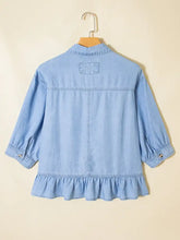 Light blue chambray half sleeve button down ruffled high low shirt with embroidered patch on the back