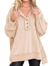 Beige half snap long sleeve sweatshirt with button-front detail and relaxed fit suitable for machine wash and tumble dry care instructions