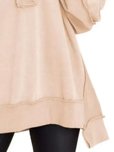 Beige half snap long sleeve sweatshirt with ribbed cuffs and hem featuring relaxed fit, machine wash care instructions, tumble dry