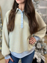 Half snap long sleeve sweatshirt in soft ribbed knit with pale yellow and light blue stripes and matching button closure
