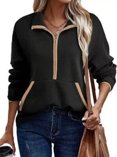 Black ribbed knit half zip dropped shoulder sweatshirt with tan zipper trim accents, machine wash friendly