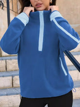 Half zip dropped shoulder sweatshirt in blue fleece with light blue contrast stitching on sleeves and zipper pull suitable for machine wash