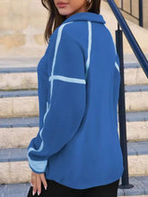 Blue half zip dropped shoulder sweatshirt with light blue contrast stitching stripes on sleeves and back, machine wash safe