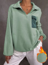 Mint green fleece half zip dropped shoulder sweatshirt with dark teal zippered pocket and ribbed cuffs for best fit machine wash
