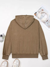 A tan half zip kangaroo pocket mineral wash baggy hoodie with relaxed fit and ribbed cuffs