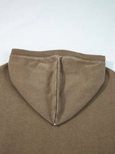 A soft muted brown half zip kangaroo pocket mineral wash baggy hoodie with ribbed collar and subtle center seam stitching