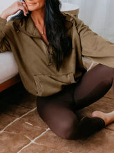 Olive green half zip kangaroo pocket hoodie with ribbed cuffs and mineral wash finish in baggy fit