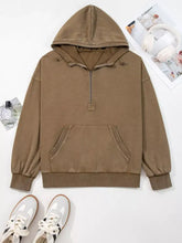 A cozy muted brown half zip mineral wash baggy hoodie with soft cotton fabric and ribbed cuffs