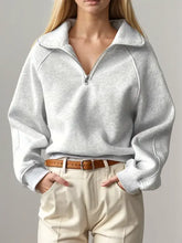 Light grey marled half zip long sleeve sweatshirt with quarter-zip and wide collar