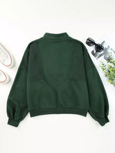 Dark green oversized half zip stand collar sweatshirt with ribbed cuffs slightly stretchy and machine wash safe