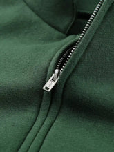 Dark green half zip stand collar sweatshirt with silver zipper pull, slightly stretchy fabric, machine wash safe