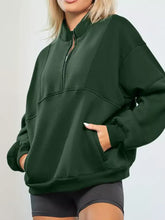 Dark green oversized half zip stand collar sweatshirt with front pockets ribbed cuffs and slightly stretchy fabric machine wash safe