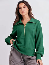 Green half-zip collared sweatshirt with long cuffed sleeves