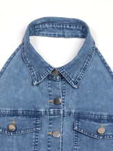 Blue denim jacket with classic collar and silver buttons styled with a halter neck button-front denim dress