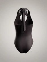 Black satin halter neck bodysuit with ruched detailing and tied bow at the back showcasing the back side design