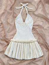 Cream halter neck ruffle hem ribbed knit sweater dress with tied straps
