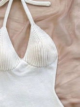 White ribbed knit halter top with shimmering texture and tie straps on Halter Neck Ruffle Hem Knit Sweater Dress