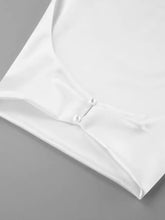 White satin halter neck satin cami blouse with delicate pearl buttons and smooth satin fabric