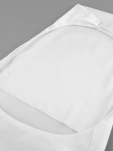 White satin halter neck satin cami with subtle sheen and delicate pearl button closure