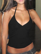 Black halter neck slim fit cami with deep v-neckline and ruched fabric for a stylish and flattering look