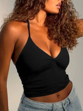 Black cropped halter neck slim fit cami with deep v neckline and thin straps for stylish summer wear