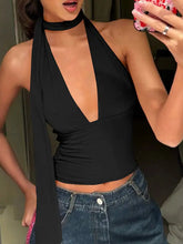 Black halter neck tie cami with deep v-cut and draped fabric featuring a stylish neck tie design