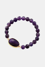 Handmade amethyst beaded bracelet with gold-framed teardrop gemstone centerpiece