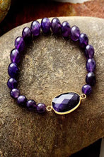 Handmade amethyst beaded bracelet with gold accents and teardrop gemstone