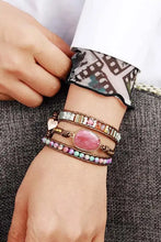 Handmade crystal beaded natural stone bracelet with pink gemstone on wrist