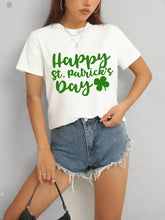 Women’s white short sleeve t-shirt with Happy St. Patrick’s Day graphic and shamrock