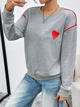 Heart embroidered round neck sweatshirt in gray with red trim and heart detail made of slightly stretchy material
