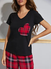 Black v-neck short-sleeved pajama top with a red black and white plaid heart patch in a Heart Graphic V-Neck Top lounge set