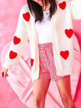 Cream dropped shoulder cardigan with red heart print patches