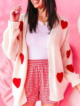 Cream dropped shoulder cardigan with red heart print patches