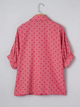 Pink heart print button-down shirt with subtle red hearts and fine vertical stripes, rolled-up three-quarter sleeves