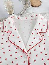 Heart print long sleeve pajama top with red trim, white with red hearts