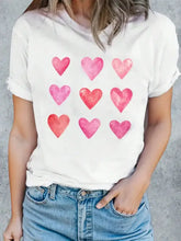 Cream t-shirt with pink and red watercolor hearts, heart round neck short sleeve
