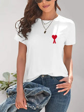 Woman in heart round neck short sleeve t-shirt, jeans, sunglasses