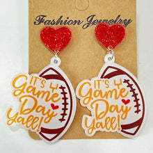 Glittery heart and football Game Day acrylic dangle earrings